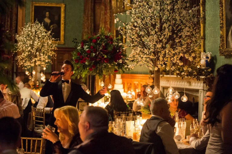 Singer performing during a candlelit wedding dinner