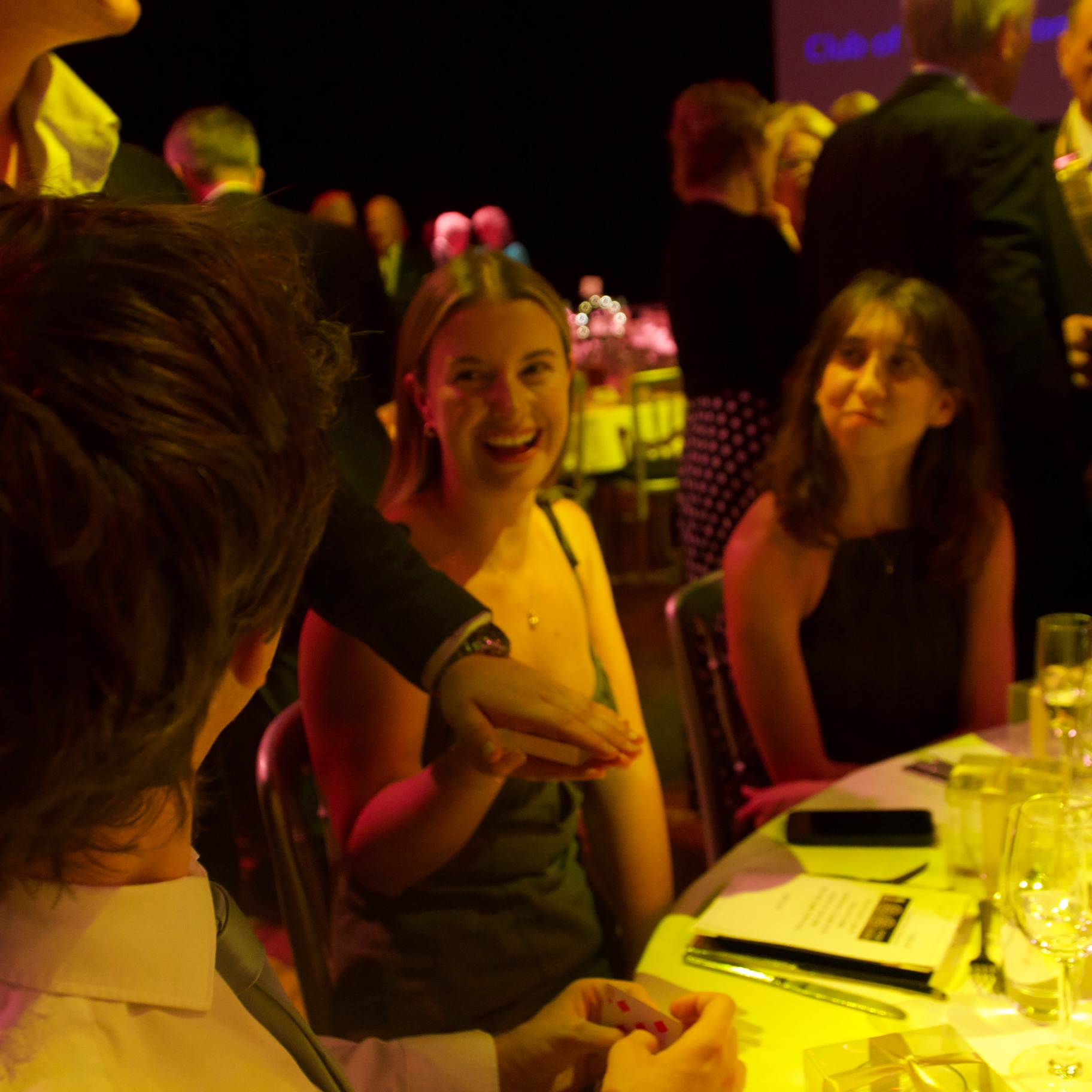 Close-up magic at a gala dinner table